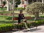 Sonya resting on a bench in Golestan Palace gardens