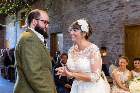 York Wedding Photography at Barmbyfield Barns exchange of rings in ceremony