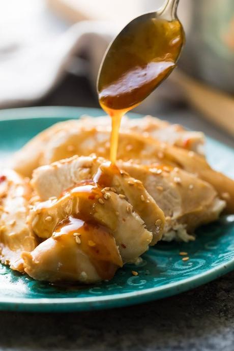 Instant Pot honey sesame chicken breast is simple to prep, easy to cook, and comes out perfectly juicy every time! This recipe comes with a sweet and savory sauce that you can spoon over rice or veggies, and it can be turned into Instant Pot freezer packs for an easy meal prep dinner idea. #mealprep #sweetpeasandsaffron #instantpot #chicken