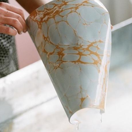 Decor inspiration. Calico wallpaper. Process of co-founder @rachelmosler lifting marbled paper out of the methylcellulose bath. Photo by @lauren___coleman.