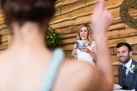 Bride points at cheering mom during speeches Best York Documentary Photography