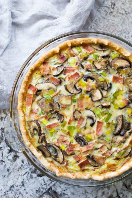 Bacon mushroom make ahead quiche is easy to prep ahead and freeze for an easy brunch or lunch. Tips on how to reheat frozen quiche, and how to serve it as a meal prep lunch. #sweetpeasandsaffron #mealprep #dairyfree #quiche #freezer