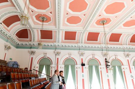 A fun Yorkshire Wedding grooms pose in front of beautiful victorian ceiling