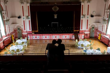 Silhouette of groom's kissing at Victoria Hall Saltaire