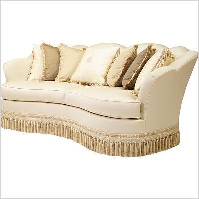 curved sofa with fringe