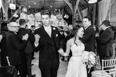 Groom fist pump as he walks back up aisle Preston Court Wedding Photography