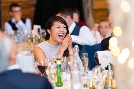 Guest smiling and laughing during the speeches Preston Court Wedding Photography