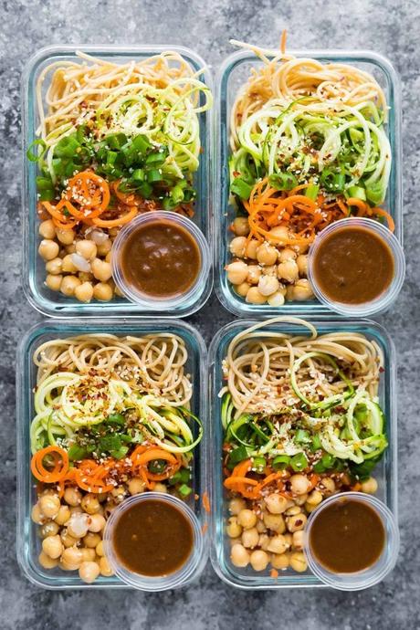 These cold sesame noodle meal prep bowls are the perfect vegan prep ahead lunch: spiralized vegetables tossed with chickpeas and whole wheat spaghetti in a spicy almond butter sauce. #sweetpeasandsaffron #mealprep #vegan #lunch #noodles
