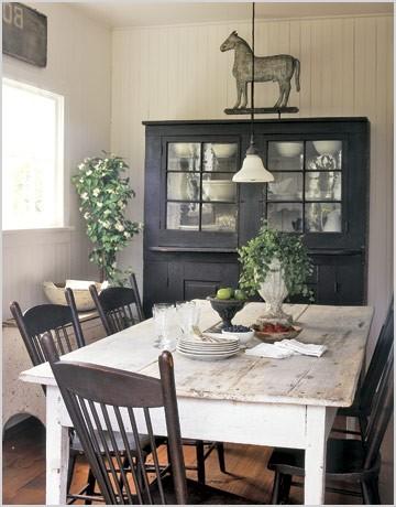 prim country farmhouse dining white chippy table old painted black chairs and cupboard