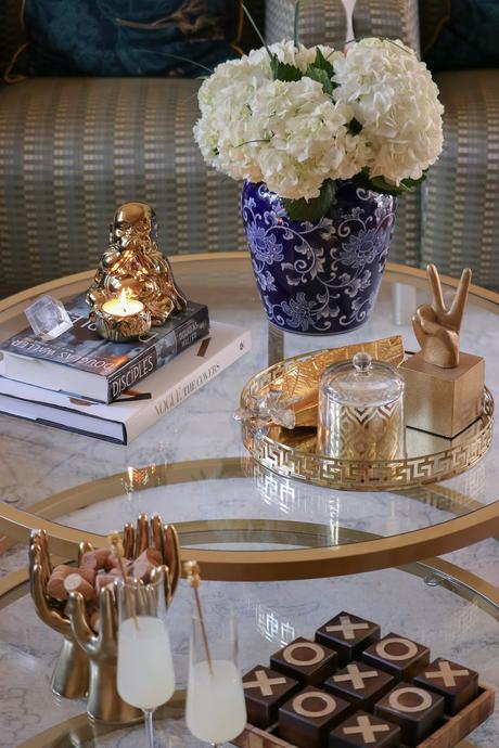 how to style your coffee table, modern living room, round coffee table, nesting coffee table, buddha statue, blue and white porcelain collection, home, interior, decor, coffe table, myriad musings