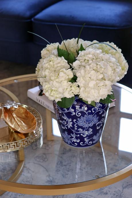 how to style your coffee table, modern living room, round coffee table, nesting coffee table, buddha statue, blue and white porcelain collection, home, interior, decor, coffe table, myriad musings