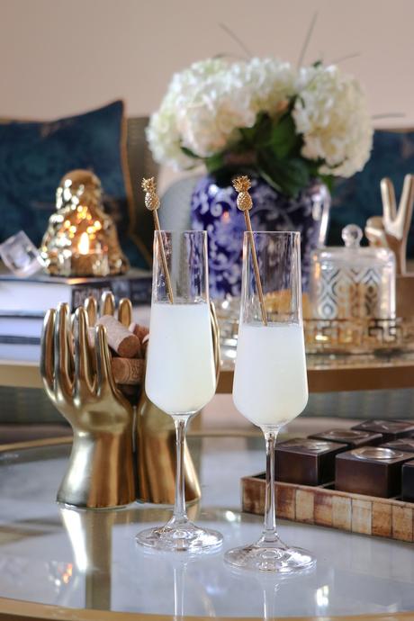 how to style your coffee table, modern living room, round coffee table, nesting coffee table, buddha statue, blue and white porcelain collection, home, interior, decor, coffe table, myriad musings