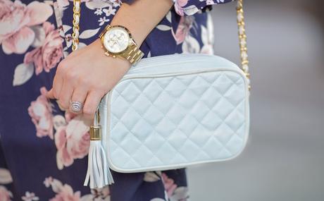 white quilted purse with navy floral dress