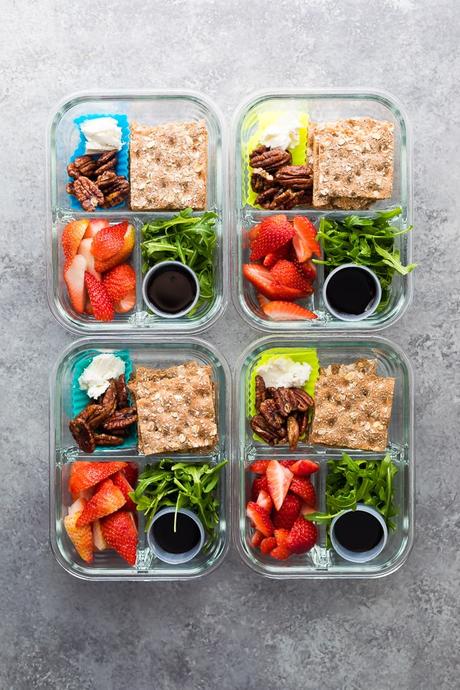 Spring strawberry bento lunch boxes are easy to whip up in under 15 minutes! With fresh strawberries, maple cinnamon pecans, balsamic reduction and more. #sweetpeasandsaffron #mealprep #bento #lunchbox #vegetarian