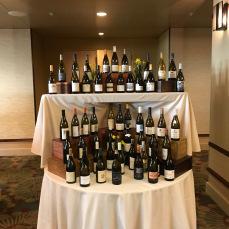 Forty bottles of chardonnay on the table...forty bottles of chardonnay...take one down and pass it around...Oregon Chardonnay Celebration 2018...© L.M. Archer