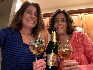 Sisters Sharing Wine Made By Sisters