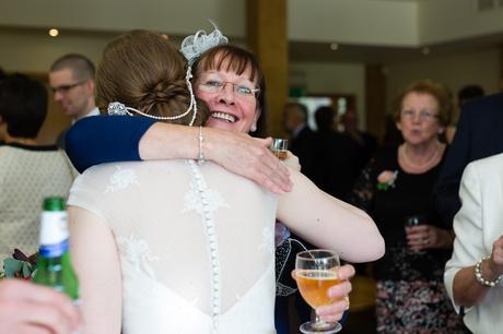 Guest hugs bride