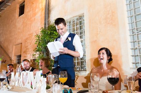 Fun Wedding Photography in Yorkshire Bride laughs as groom gives speech