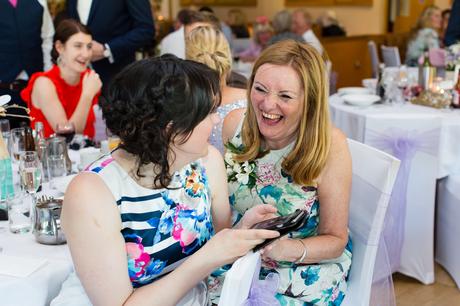 Fun Wedding Photography in Yorkshire guest laughs and smiles during speeches