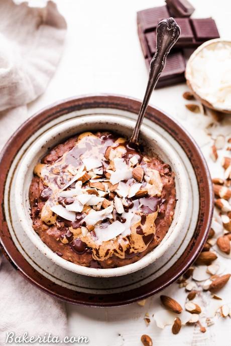 This Almond Joy Oatmeal is a creamy chocolate oatmeal that's sweetened with just a ripe banana and topped with coconut, almonds, and more chocolate! This hearty breakfast is decadent, filling, and you can enjoy it guilt free - unlike its candy bar equivalent!