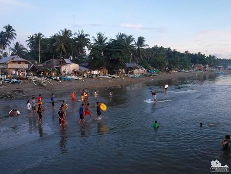 Kids spending a late afternoon of skimboarding fun