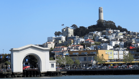 A view of SFO's buildings with the Coit tower in the backdrop