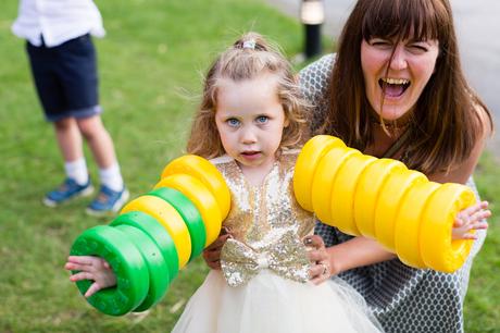 Little girl haivng fun with garden games at East Riddesden Hall