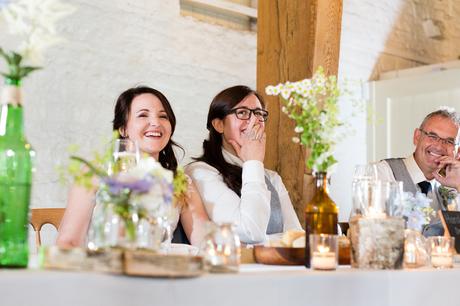 Brides laughing at speeches
