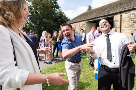 Guests laughing at East Riddlesden Hall wedding