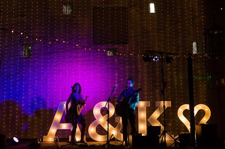 Band playing in colourful light East Riddlesden Hall Wedding Photography