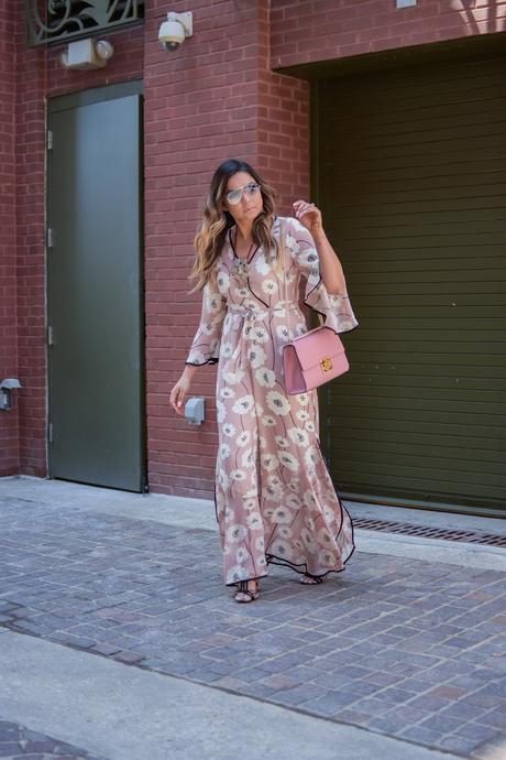 lucca couture floral flared jumpsuit, floral forever 21 jumpsit, spring fashion, pink jumpsuit with slit, pink gucci marmont bag, strap sandals, blonde hair, myriad musings