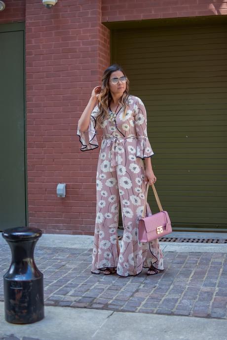 lucca couture floral flared jumpsuit, floral forever 21 jumpsit, spring fashion, pink jumpsuit with slit, pink gucci marmont bag, strap sandals, blonde hair, myriad musings