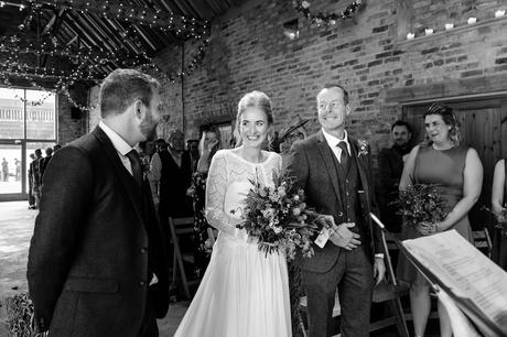 Barmbyfield Barn Wedding Photography bride walks up the aisle and sees groom for first time. 