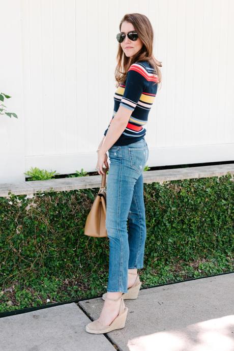 Amy havins wears a striped top and jeans.