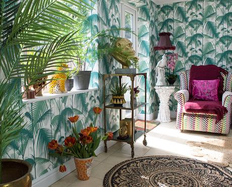 Inspiration for tropical inspired interiors featuring Palm Jungle wallpaper by Cole & Son, monkey statue and accessories by Audenza and plenty of layers of house plants.