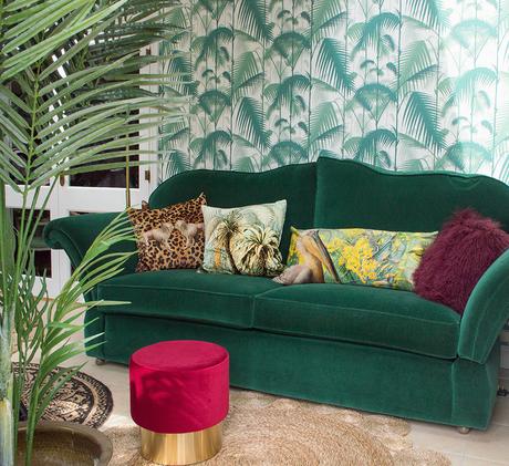 Tropical Decor- Green velvet sofa with Palm Jungle wallpaper by Cole & Son and patterned velvet cushions by Audenza.