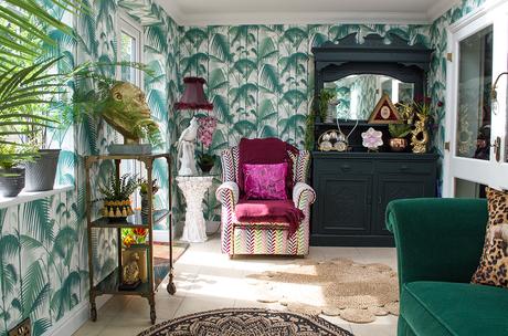Inspiration for tropical inspired interiors featuring; Palm Jungle wallpaper by Cole & Son, green velvet sofa and plenty of layers of house plants.