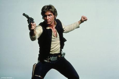 Harrison Ford as Han Solo with his blaster in the old Star Wars triology.