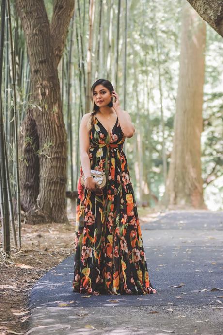 wedding guest style, maxi dress, front plunge dress, low neck maxi dress, forever 21 black floral dress, party ready, sexy, side braid, feather earings, sam edleman clutch, summer floral dress, yellow heels, myriad musings