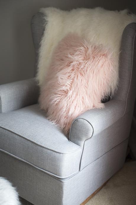 Cozy reading corner in the baby nursery