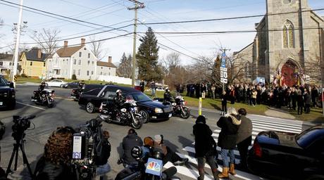 Funeral services took place for Benjamin Andrew Wheeler, one of the students killed in the Sandy Hook Elementary School shooting, while a hearse with another shooting victim drives by