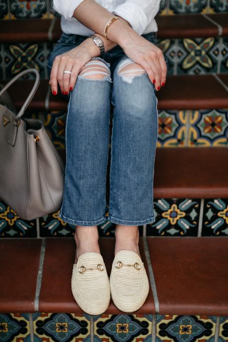 Amy Havins wears a white blouse and jeans.