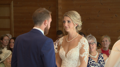 The bride and groom share their personal vows with each other
