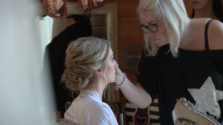 ruby slippers make up artist from ormskirk concentrates as she applies eye make up to the bride at Styal lodge