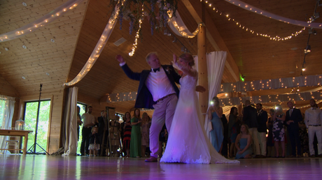the bride and her dad have fun bumping hips during their father and daughter dance at Styal Lodge in Cheshire