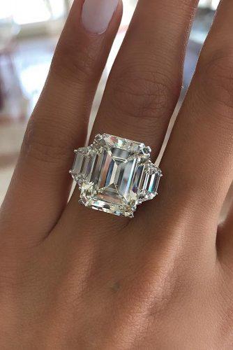 todays top engagement trends emerald cut diamond three stones