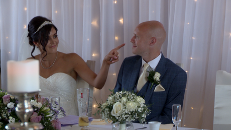 the bride points accusingly at the groom after their mr and mrs quiz at the Blue Mallard in burscough