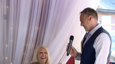 the father of the bride makes his wife laugh during his speech at the Blue Mallard in Burscough lancashire