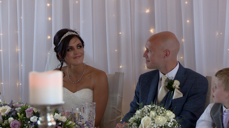 the bride tries not to cry during her dads father of bride speech at the blue mallard