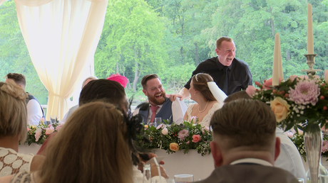 the groom has the singing waiter laughing during their set at the lakeside marquee